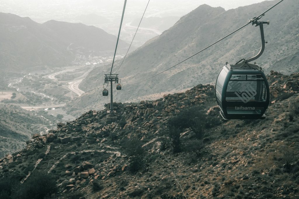 a cable car going up a mountain side Thaif
