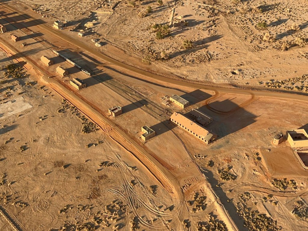 an aerial view of a desert town in the middle of the desert